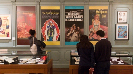 Visitors attend an exhibit at Houghton Library