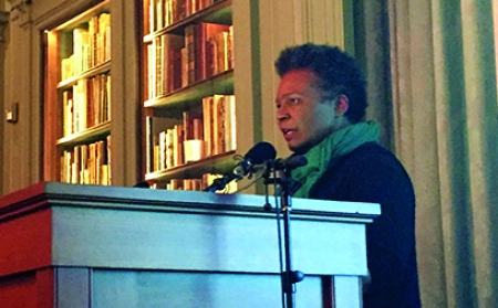 Claudia Rankine reads from CITIZEN at a podium