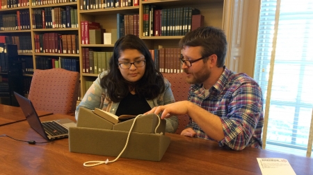 2017-2018 Visiting Fellow​ Dr. Ermine Algaier and his research assistant Diana J. Rhubi in Houghton Library's reading room.​