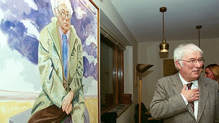 Seamus Heaney beside his portrait in the Poetry Room