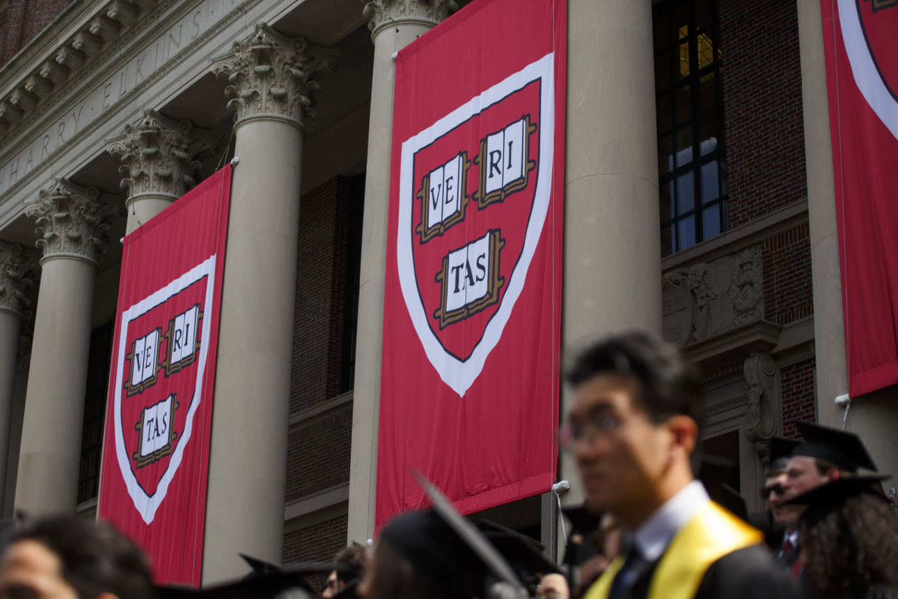 Banners hang from Widener Library during commencement 