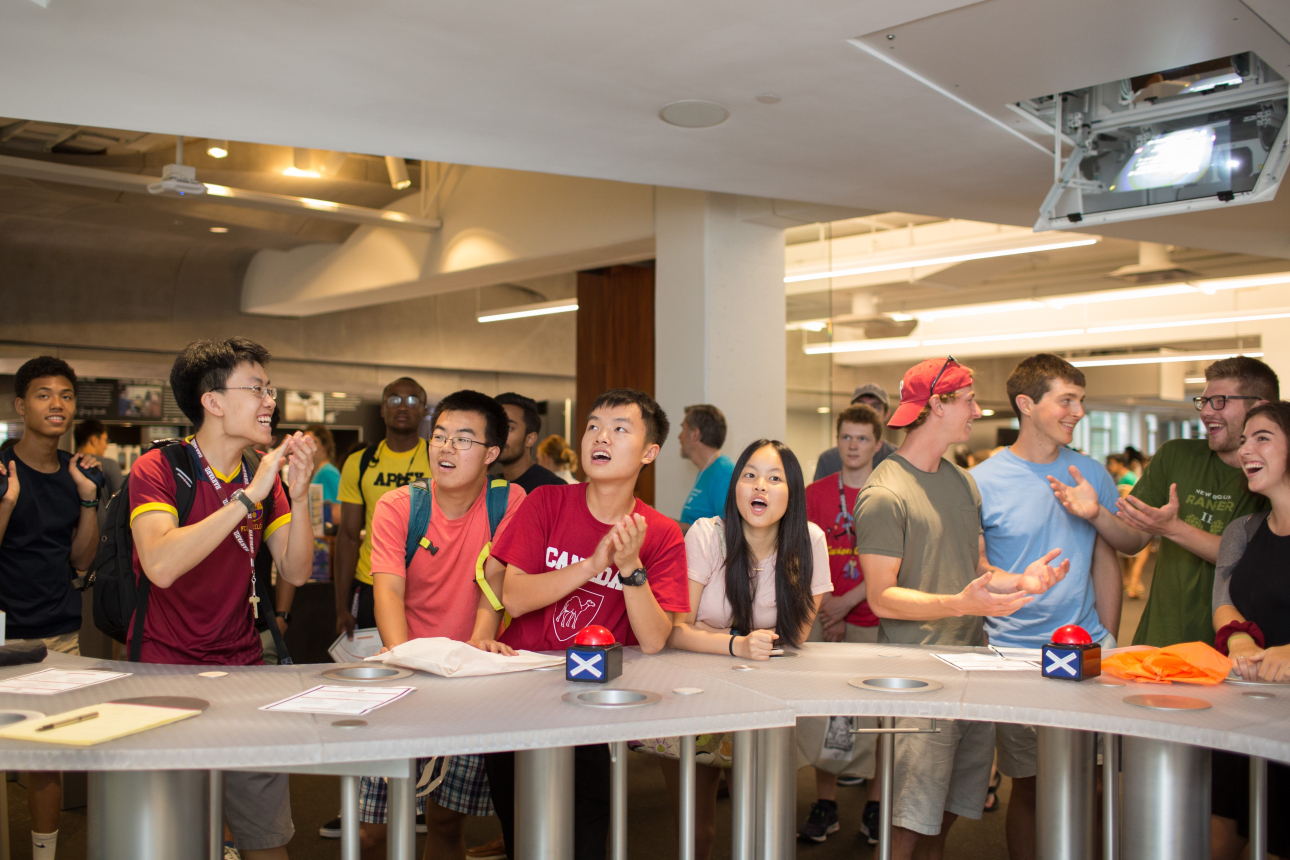 Students at Cabot's Discovery Bar reacting to a trivia question.