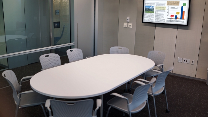 A group study room in Cabot with a table surrounded by chairs