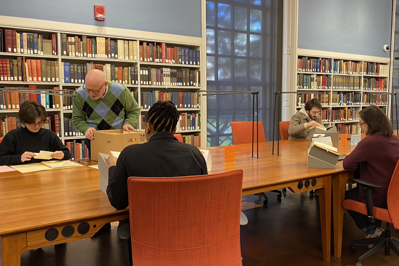 Researchers sit in the reading room at Houghton Library