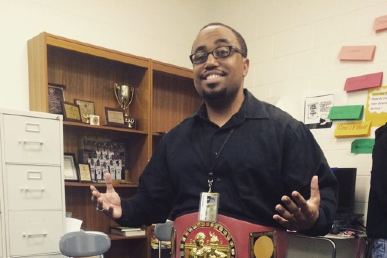 Mr. Opus standing in a room with a fancy belt. 