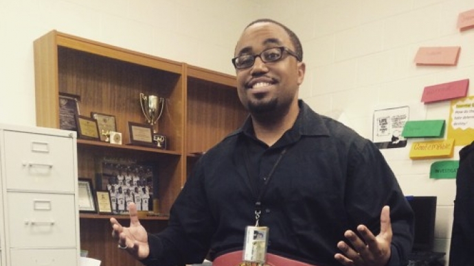Mr. Opus standing in a room with a fancy belt.