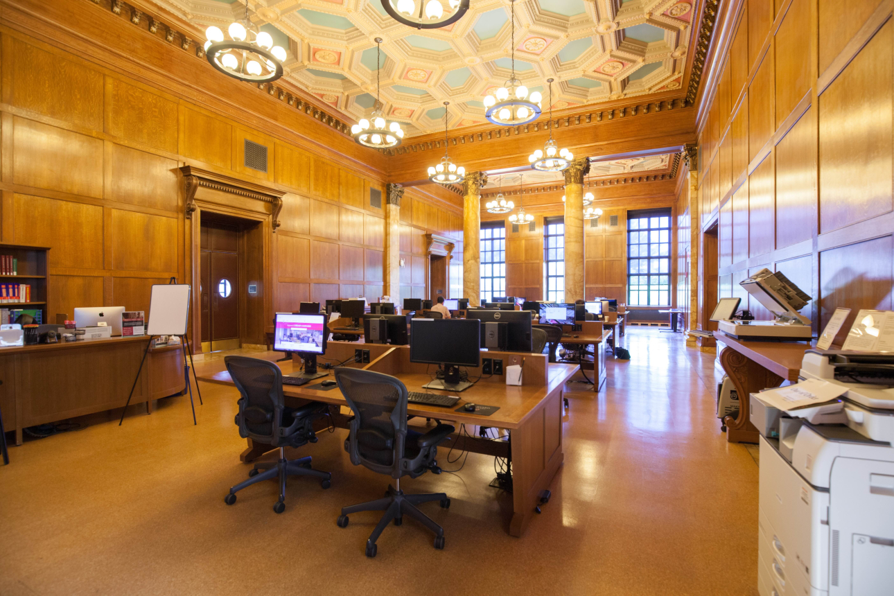 Desks with computers in the Atkins Reference Room at Widener Library