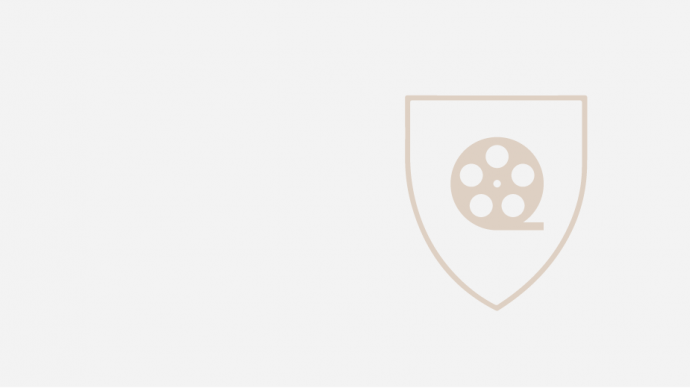 Icon of a film real in the the outline of a shield