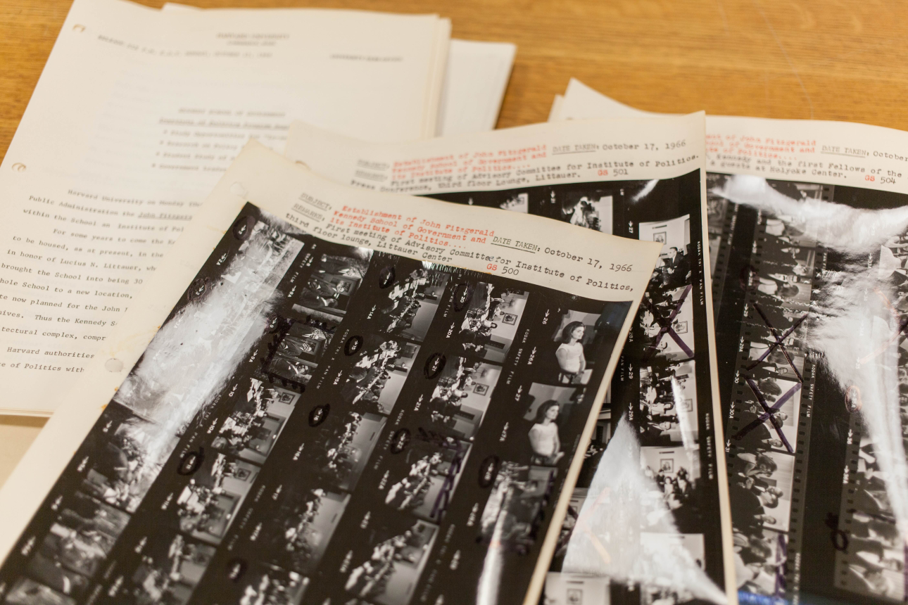 A photo of materials held by the Harvard University Archives related to the establishment of the Kennedy School
