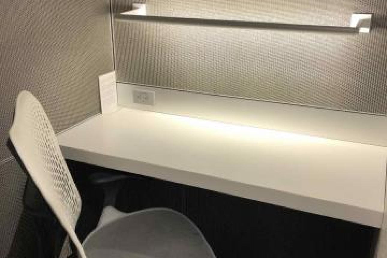 A desk with a single chair