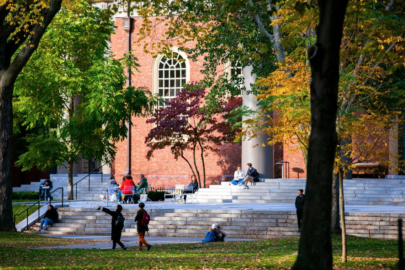People walk through Harvard Yard