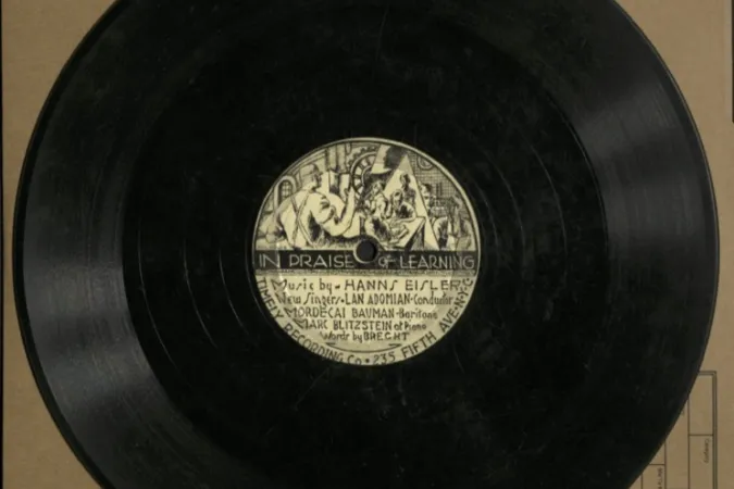 78rpm disc with an illustrated label showing factory workers.