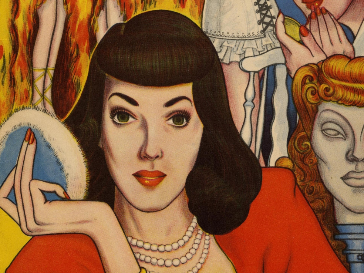 Person in drag wearing black wig, pearls, and red dress holds up powder puff.