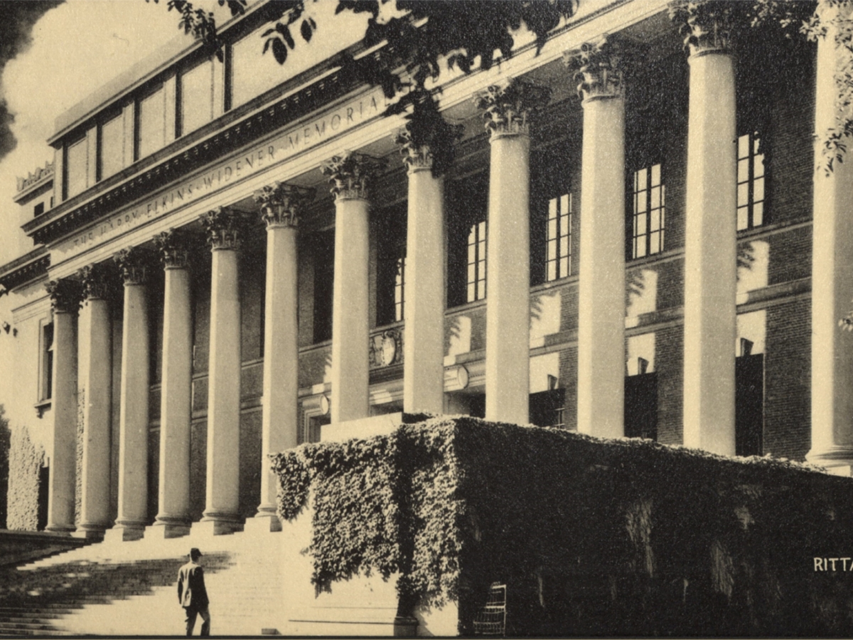 A man ascends the stairs of Widener Library.