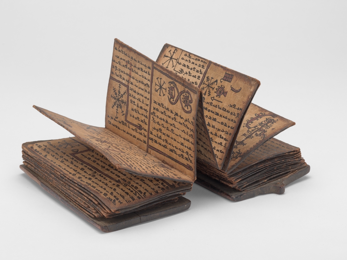 An accordion-style book written in a secret variation of the Batak language.