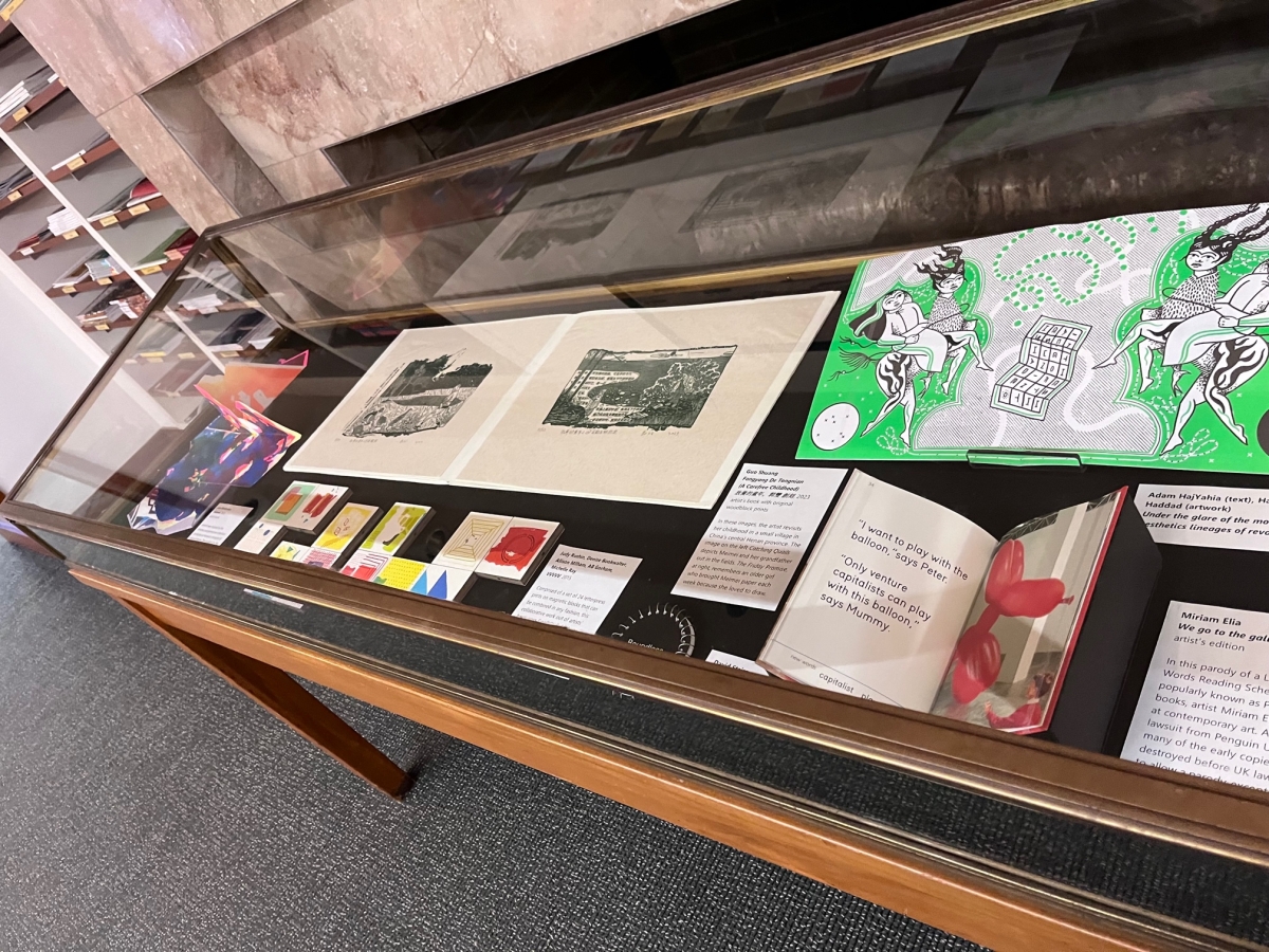 Display case with colorful artists’ books 