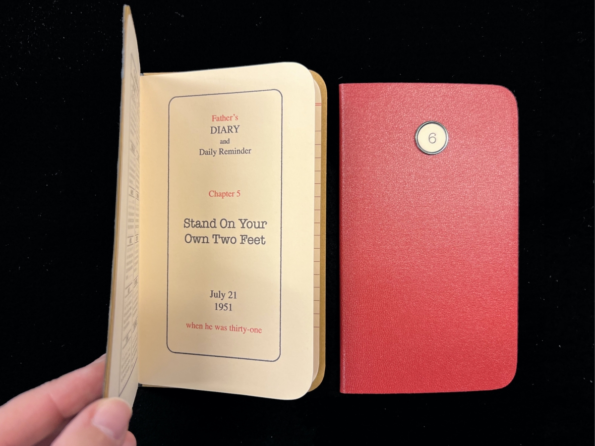 Two small pocket size artists books. One on the left is opened to show the title page.