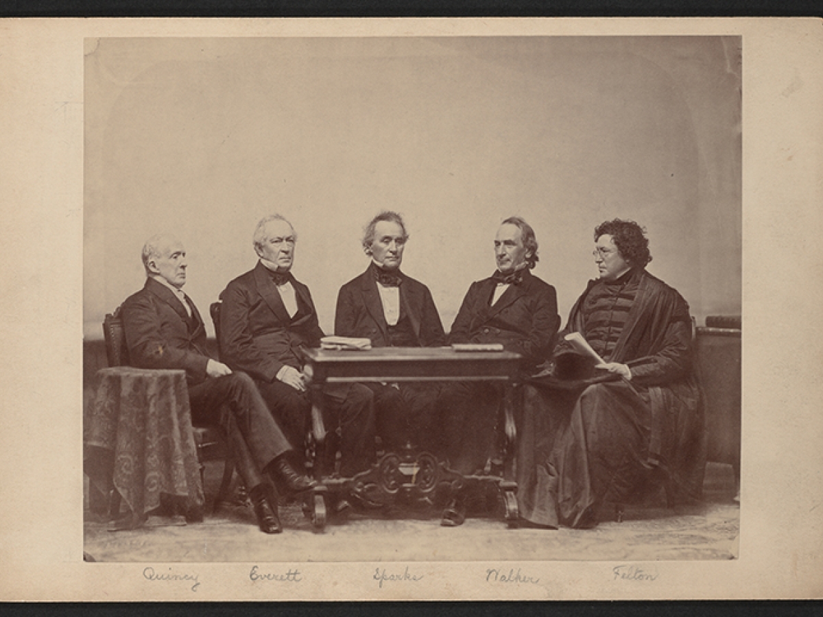 Photograph of five Harvard Presidents sitting at a table.  From left to right: Josiah Quincy, Edward Everett, Jared Sparks, James Walker, and Cornelius Conway Felton.