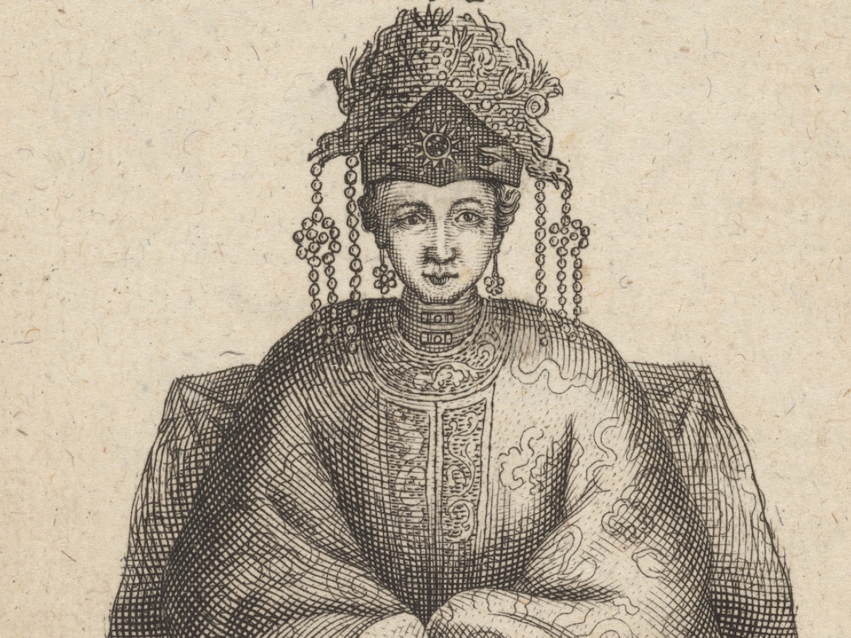 Asian woman wearing headdress and silk gown