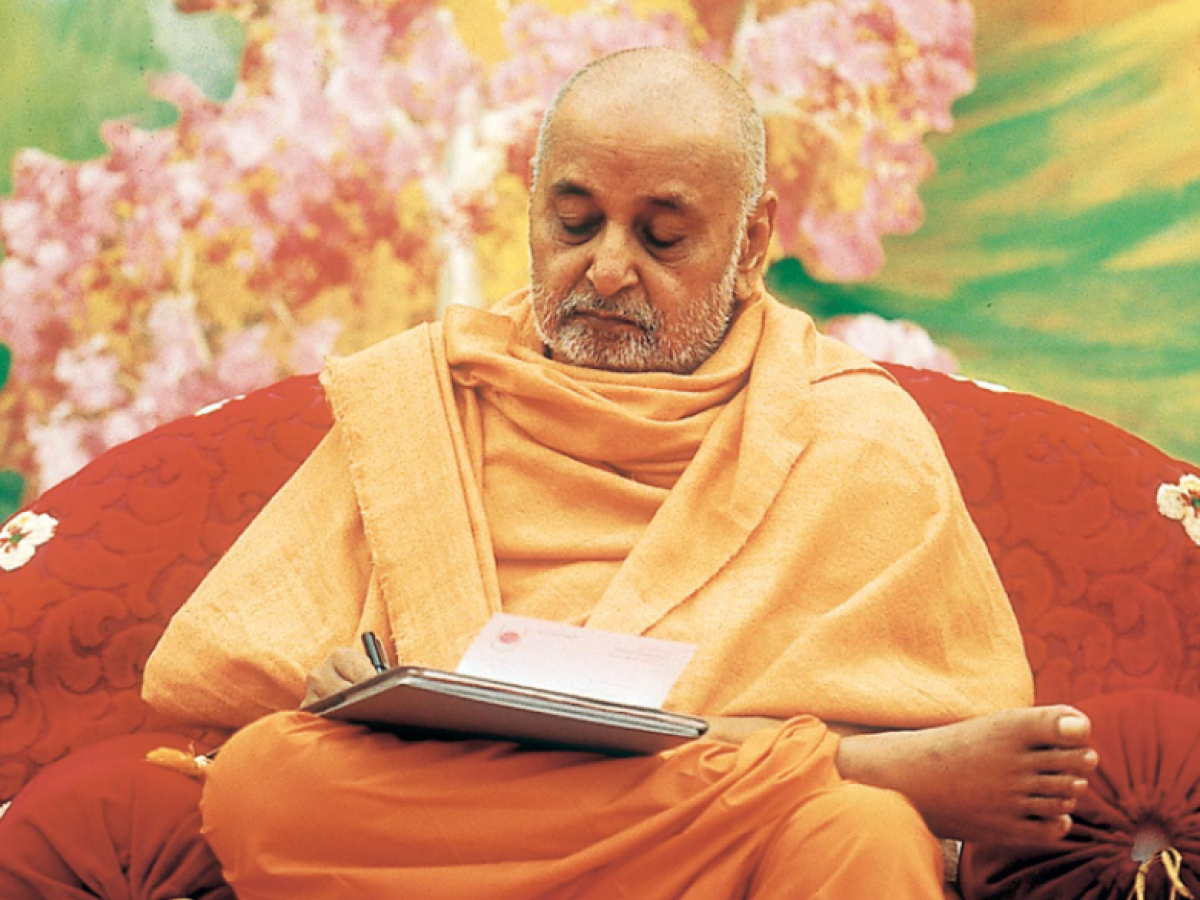 Photograph of a man in orange monk's robes
