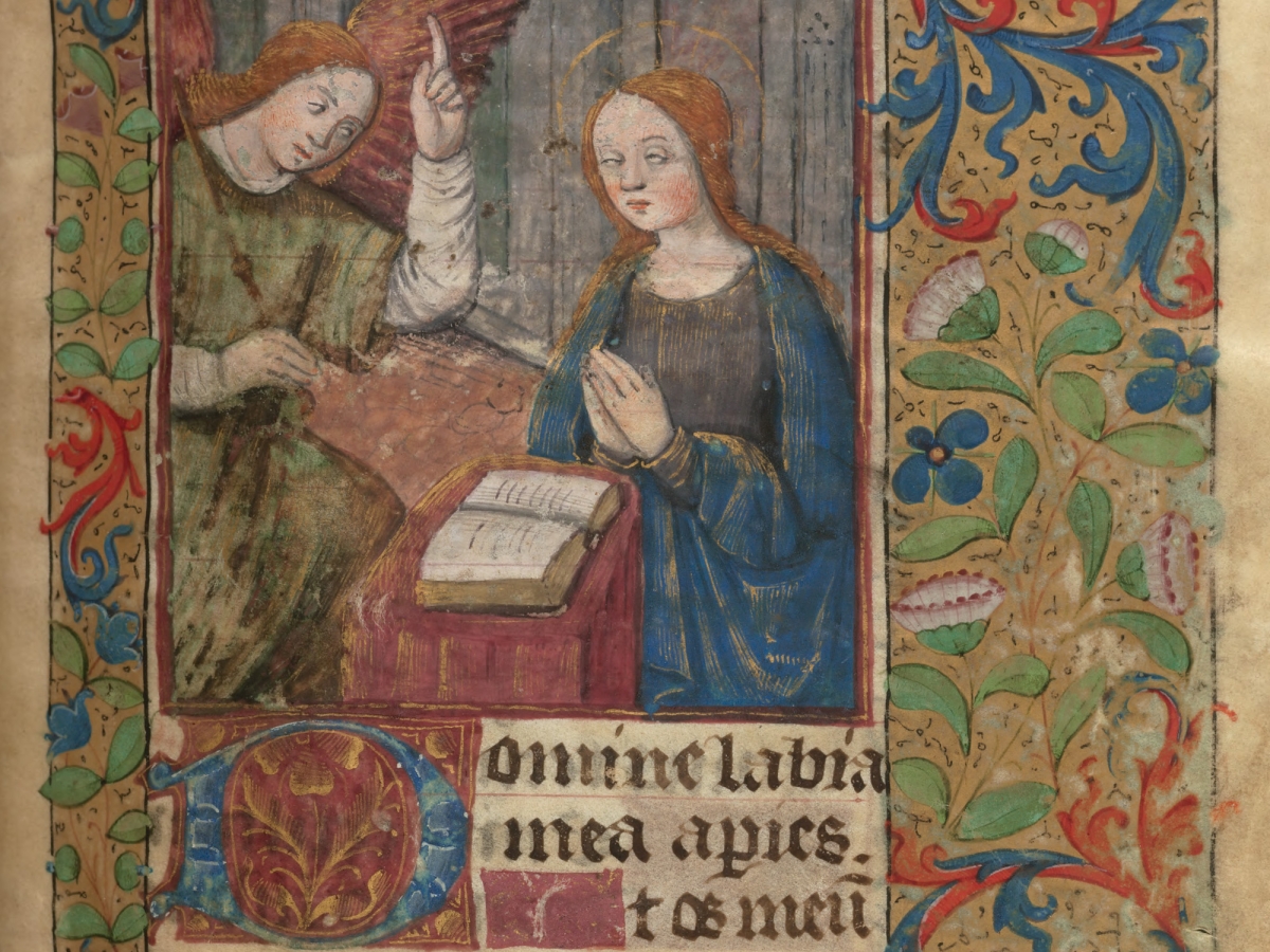 Illuminated manuscript page with floral decorative border framing the Annunciation scene with Gabriel, Mary, and an open book.