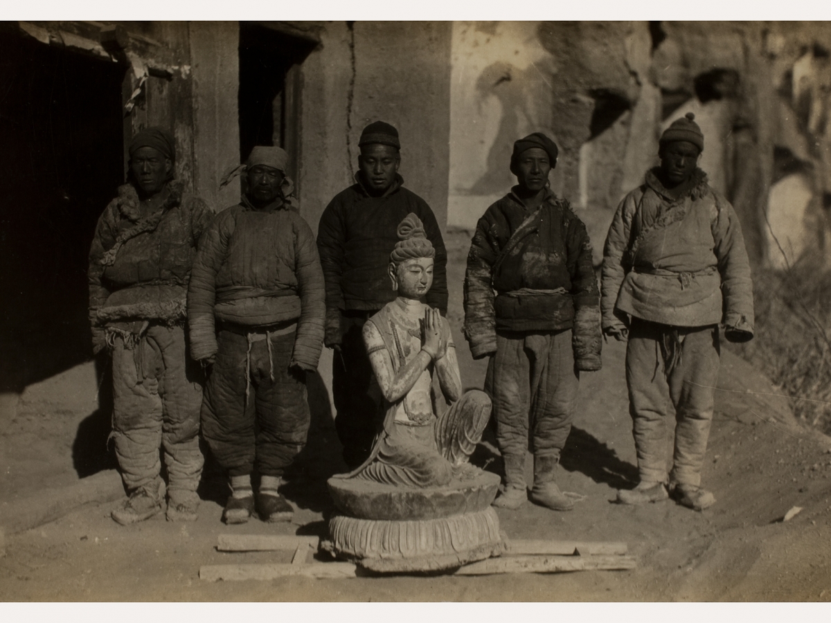 Removal of the Kneeling Attendant Bodhisattva statue.