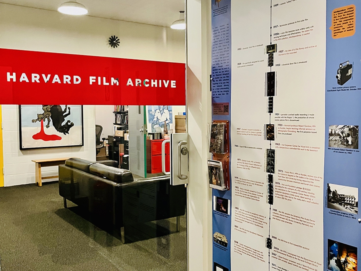 a view of the HFA film timeline poster next to the glass door of the offices