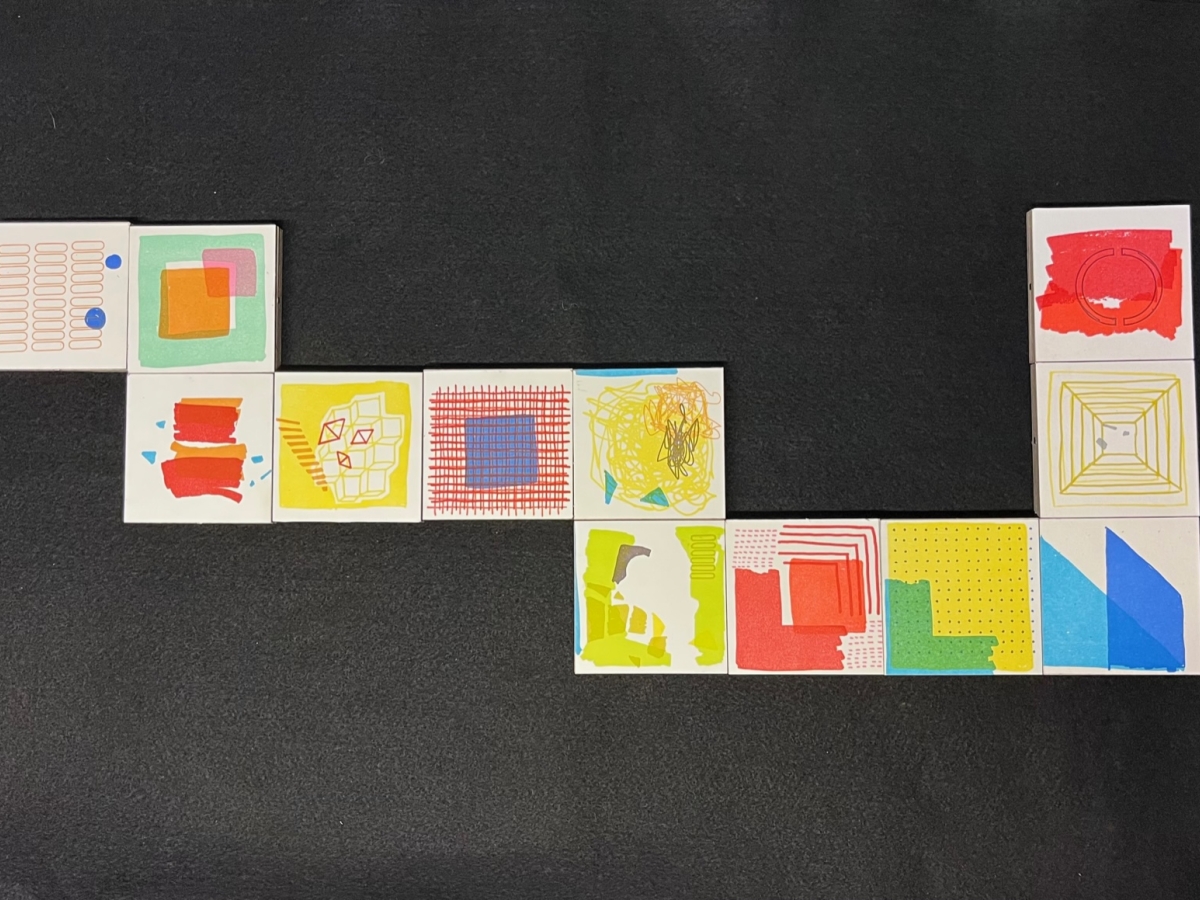 Letterpress printed magnetic blocks arranged in a snake-like formation 