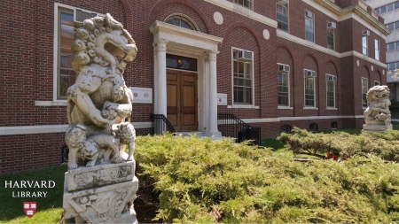 Photograph of a statue outside of a brick building
