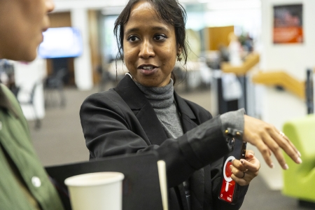 Jashu speaking to someone and describing her installation.