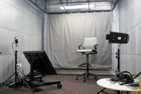 small room with chair and AV equipment