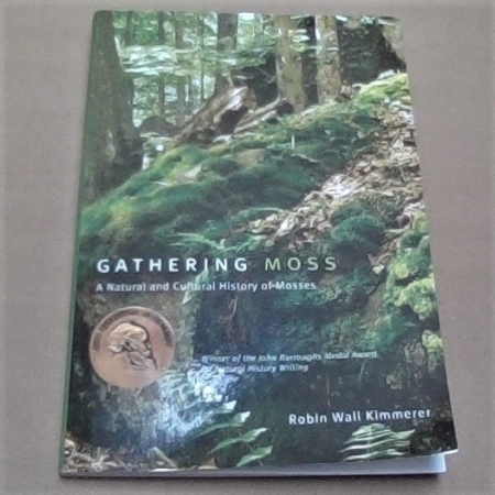 Photo of book on moss