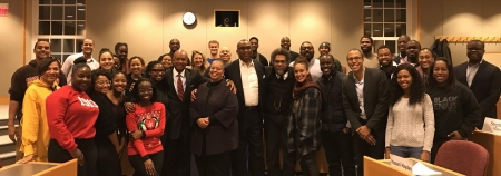 Prof. Rogers (center) next to Dr. Cornel West (center, on his right) and a cohort of students after their final presentations.