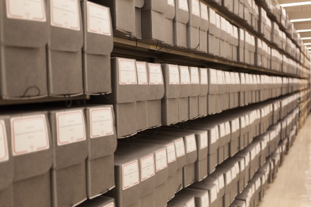 multiple shelves of archival boxes stretching into the distance