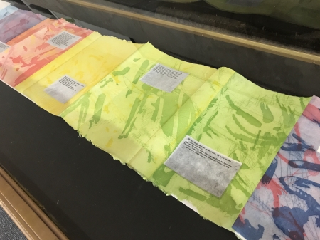 colorful page spread with text on it in a display case