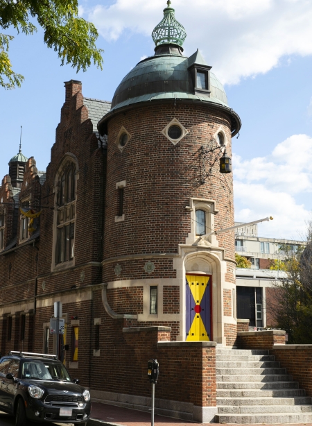 Column-shaped brick building with painted door