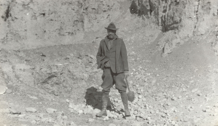 Langdon Warner standing in front of rocks at Kara Khoto