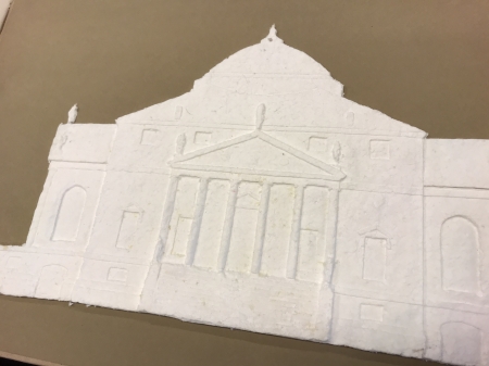 An embossed building (all white) on a brown background