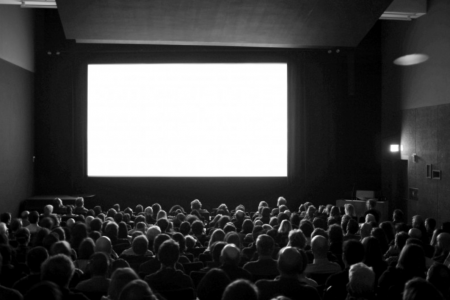 People sit in a movie theater