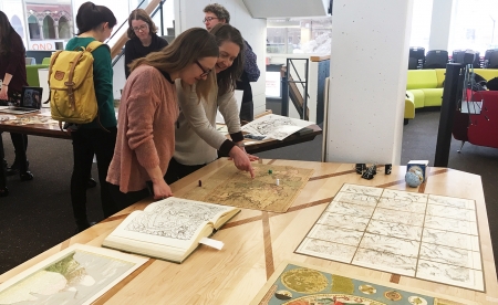 Unabridged participants look at special collection materials.