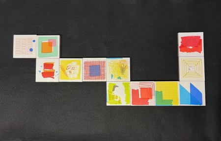 Letterpress printed magnetic blocks arranged in a snake-like formation