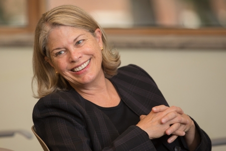 Alison Head, wearing a black top, smiles away from the camera