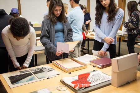 Katie Okumu, Veronica Santana, and Lainey Newman explore materials from student demonstrations on campus in the 1960s and 1970s.