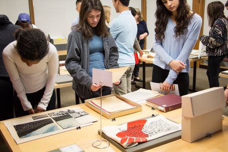 Students examine materials during a class at the Harvard University Archives