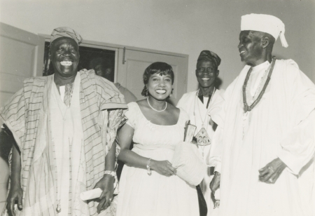 Marguerite Cartwright in Nigeria, standing around other individuals wearing white