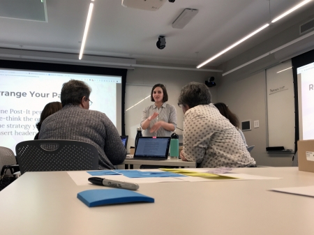 a woman teaches a group of people