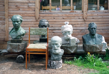 5 different busts are scattered on the ground outside