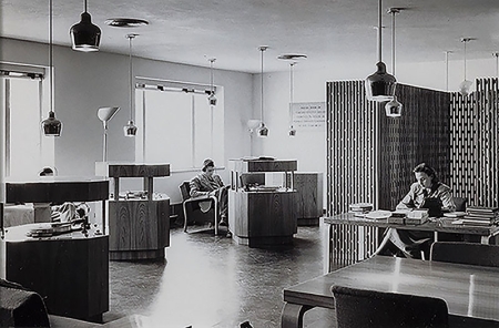 Three of the original Poetry Room record consoles are shown in use by students, circa 1950s.
