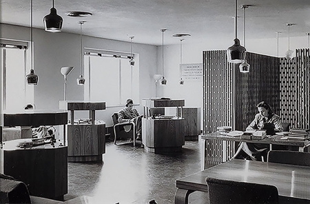 Three of the original Poetry Room record consoles are shown in use by students, circa 1950s. 