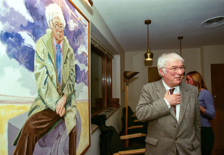 Seamus Heaney beside his portrait in the Poetry Room